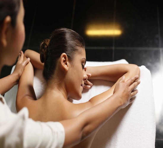 A guest relaxing during a massage